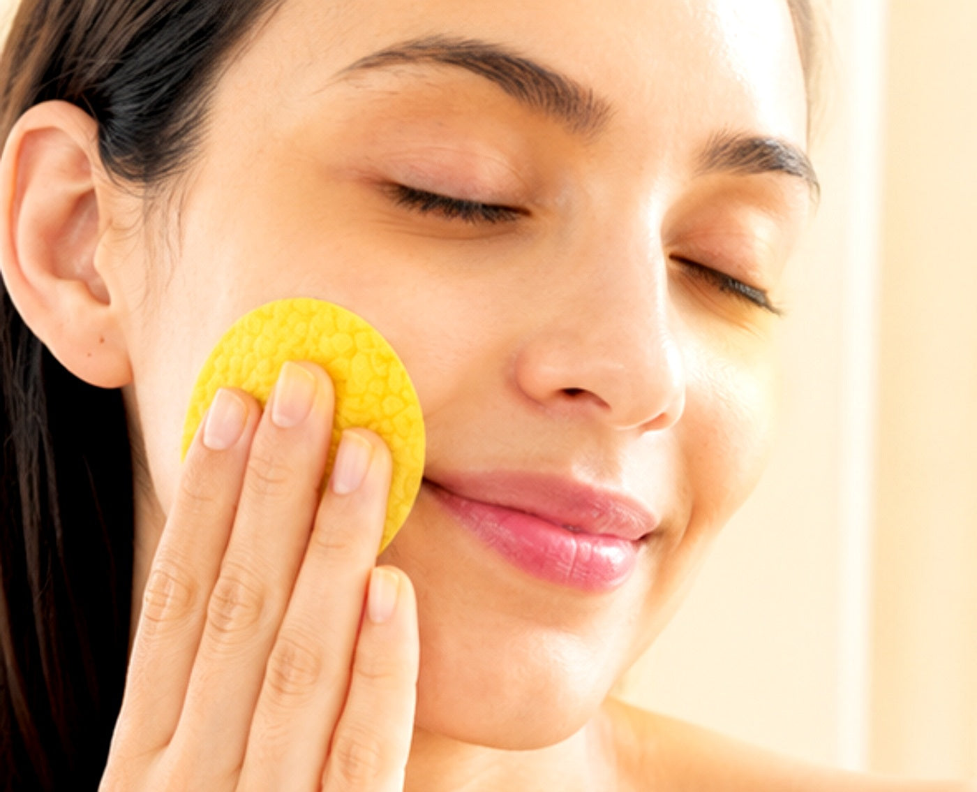 Applying a cleansing pad